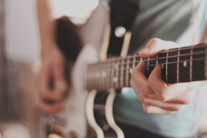 Playing guitar closeup